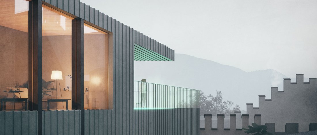 Balcone moderno con ringhiera in vetro e terrazza illuminata al crepuscolo